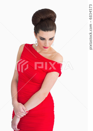 Woman with red dress looking glamorous 6834573