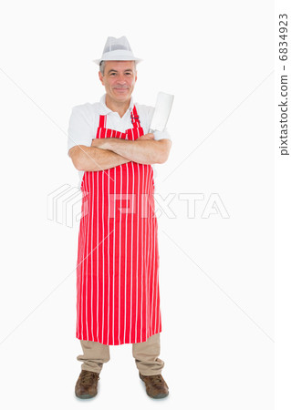 Butcher in apron with meat cleaver 6834923
