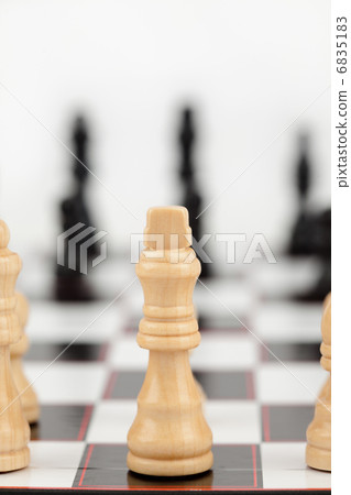 White queen standing at the chessboard 6835183