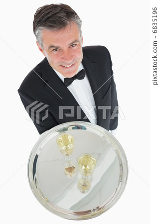 Waiter with silver tray of champagne 6835196