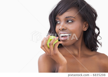Woman holding an apple smiling Woman holding an apple smiling 6835208