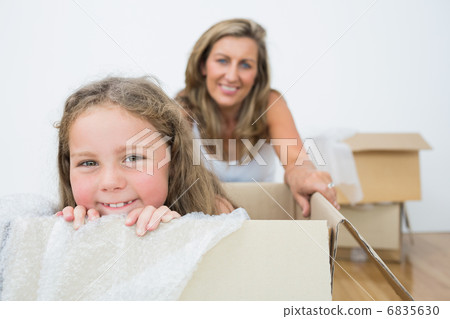 Girl sitting in box Girl sitting in box 6835630
