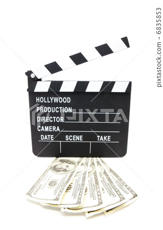 Fanned out dollars under film slate 6835853