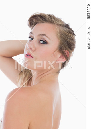 Woman holding her hair 6835950
