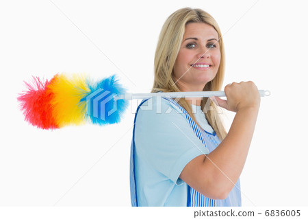 Smiling cleaning woman holding feather duster Smiling cleaning woman holding feather duster 6836005