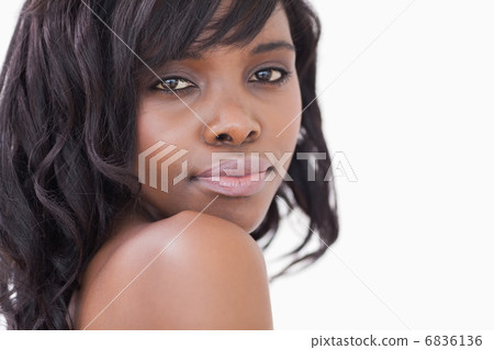 Woman looking over her shoulder and smiling Woman looking over her shoulder and smiling 6836136