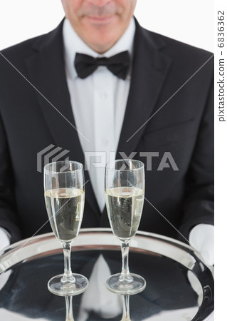 Man holding tray with champagne Man holding tray with champagne 6836362