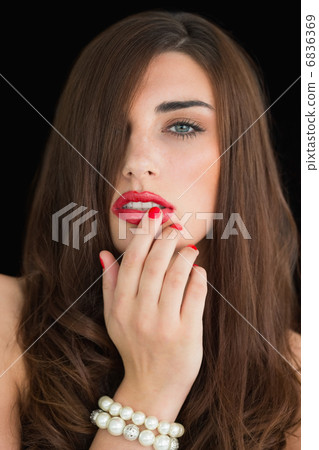 Woman touching her red lips Woman touching her red lips 6836369
