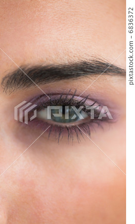 Woman wearing purple eye shadow Woman wearing purple eye shadow 6836372