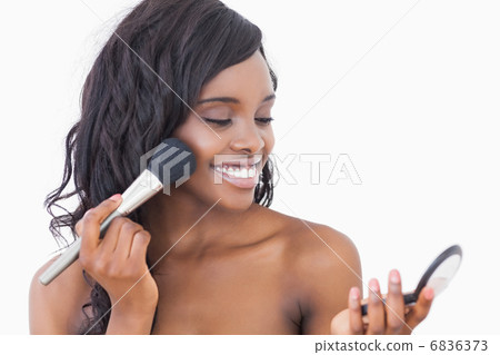 Smiling woman using powder and brush Smiling woman using powder and brush 6836373