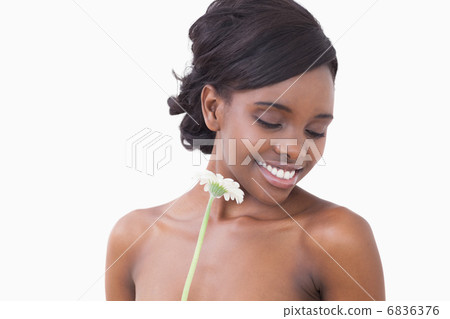Woman holding a flower Woman holding a flower 6836376