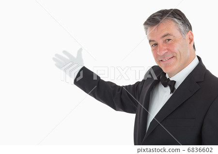 Enthusiastic waiter showing us something 6836602