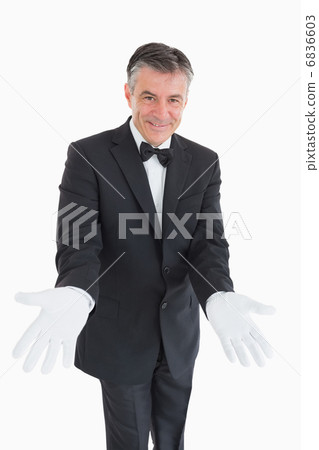 Waiter waiting with opened arms 6836603