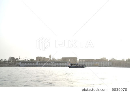 I saw the silhouette of the Luxor Temple from the Nile River 6839978