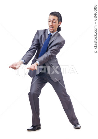Young businessman pushing invisible obstacles 6840006