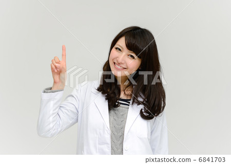 A lady in a white garment that makes one point A lady in a white garment that makes one point 6841703