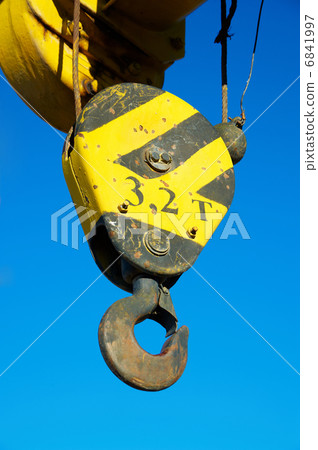 Hook of the old crane in the blue sky Hook of the old crane in the blue sky 6841997