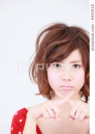 A woman giving a cross 6842618