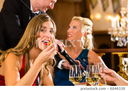 Waiter spices the dinner in a fine restaurant Waiter spices the dinner in a fine restaurant 6846330