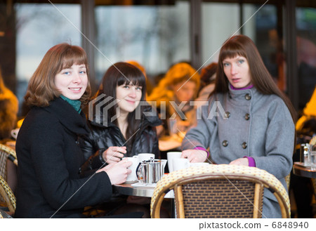 Friends in a Parisian street cafe 6848940