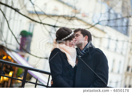 Romantic couple kissing on a Parisian street 6850178