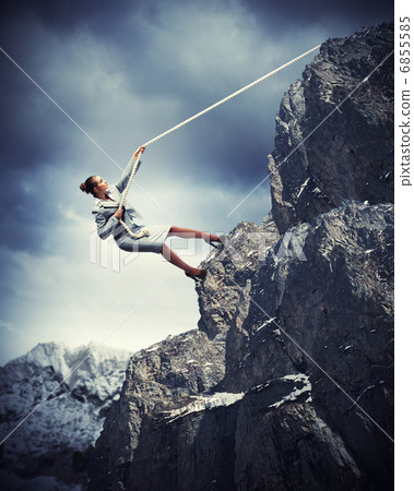 businesswoman climbing mountain businesswoman climbing mountain 6855585