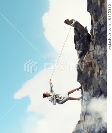 businesswoman climbing mountain businesswoman climbing mountain 6855586