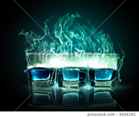 Three glasses of burning emerald absinthe 6856261