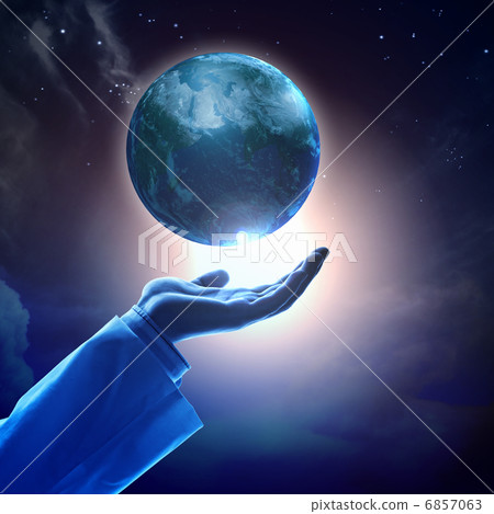 Image of earth planet on hand 6857063