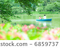 A rowing couple with a boat 6859737