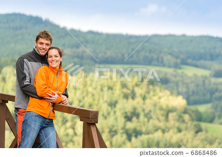 Loving couple on romantic summertime weekend hill Loving couple on romantic summertime weekend hill 6868486
