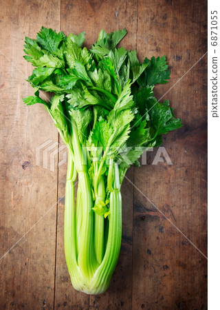 Leafed celery on old kitchen table 6871055