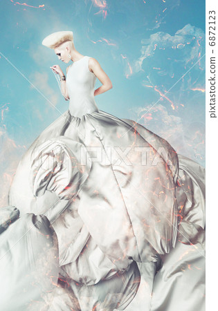 blond beautiful woman in big dress with creative hairstyle blond beautiful woman in big dress with creative hairstyle 6872123