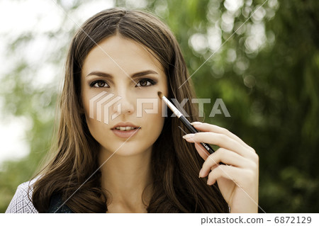 portrait of beautiful brunette girl making up portrait of beautiful brunette girl making up 6872129