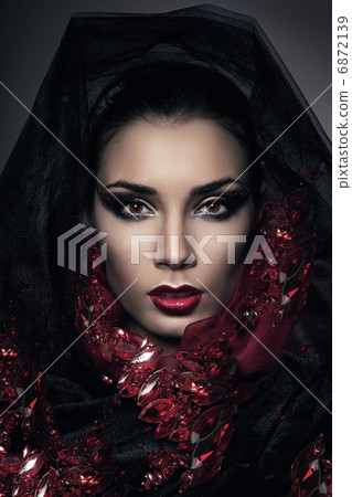 portrait of woman in hood with gemstones portrait of woman in hood with gemstones 6872139