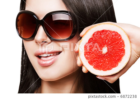 sexy woman with grapefruit in sundlasses 6872238