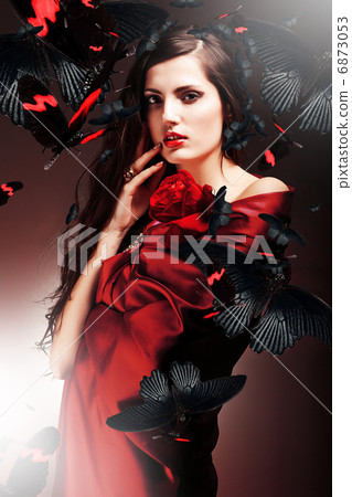 sexy woman in red fabric with red rose and butterflies sexy woman in red fabric with red rose and butterflies 6873053