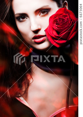 dark beautiful woman with red rose dark beautiful woman with red rose 6873064