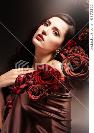 chocolate colored attractive woman with chocolate roses chocolate colored attractive woman with chocolate roses 6873392