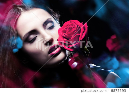 woman with red rose and blue lights woman with red rose and blue lights 6873393
