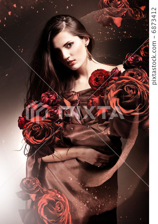 beautiful woman in chocolate fabric with chocolate roses beautiful woman in chocolate fabric with chocolate roses 6873412