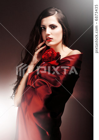 sexy woman in red fabric with red rose sexy woman in red fabric with red rose 6873435