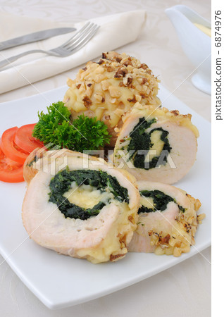Chicken roulade stuffed with spinach and cheese Chicken roulade stuffed with spinach and cheese 6874976