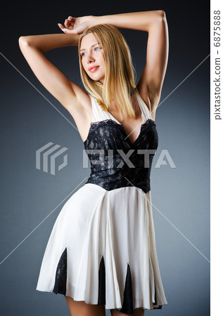 Beautiful woman in studio fashion shooting Beautiful woman in studio fashion shooting 6875888
