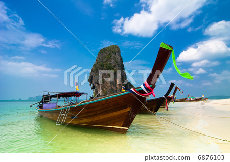 Tropical beach landscape. Thai traditional long tail boats Tropical beach landscape. Thai traditional long tail boats 6876103