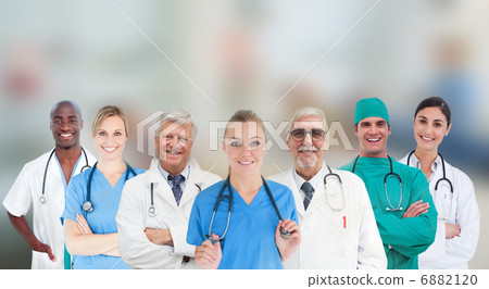 Smiling medical team standing in line Smiling medical team standing in line 6882120