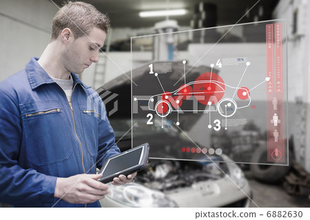 Mechanic with digital tablet at garage 6882630