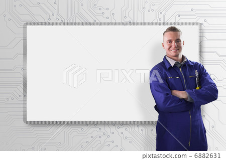Smiling mechanics with arms crossed 6882631