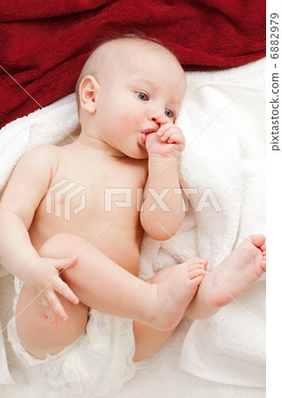Baby in white and red towels 6882979