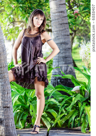 woman in the tropical garden woman in the tropical garden 6888407